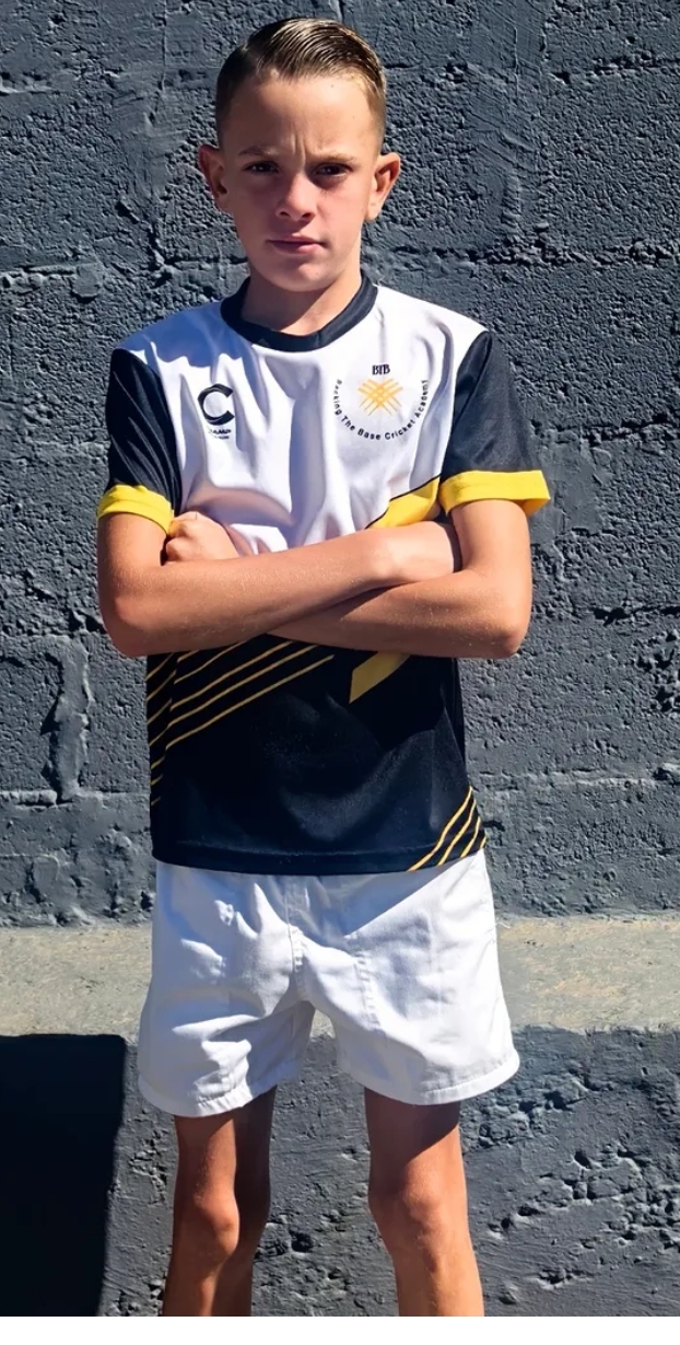 A Backing the Base Cricket Academy player in team kit